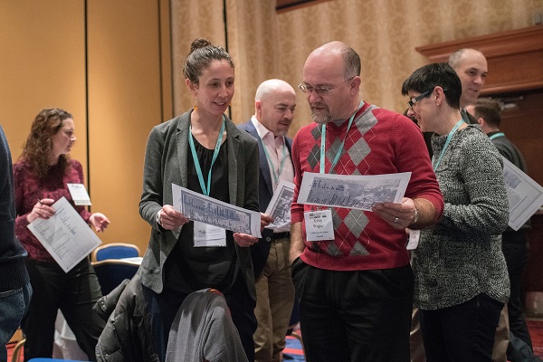 Robin Kietlinksi (LaGuardia Community Coll.) and Kevin Wagner (Carlisle Area Sch. District) confer about teaching World War I at the K–16 Educators Workshop.